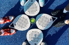 Rackets and ball on court